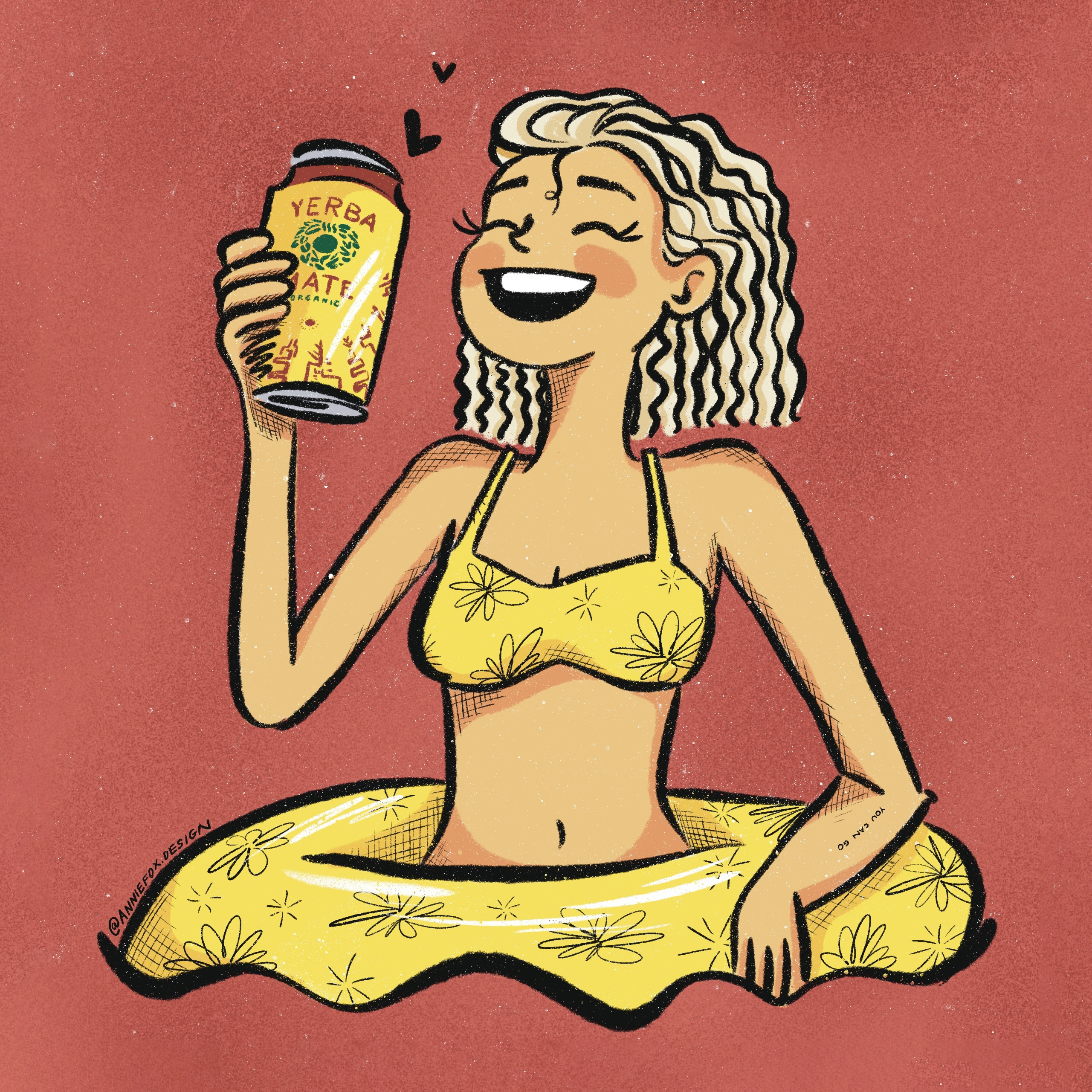 A custom digital self-portrait illustration by Annie Fox Design. The artist is depicted with blonde curly hair, a joyful expression, and a yellow floral bikini, sitting inside a matching yellow floral inner tube. She holds a yellow can of Yerba Mate organic tea. The illustration uses bold black outlines, vibrant yellow and red tones, and a signature grainy, risograph-inspired digital texture against a deep coral-red background.
